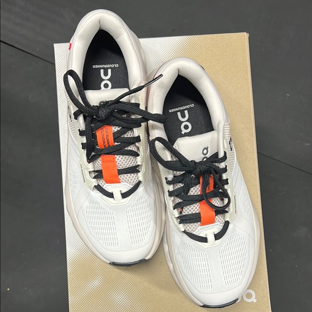 On Running White and Orange Sneakers